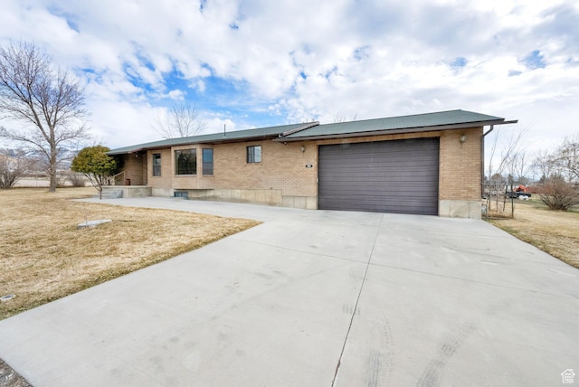 600 E 200 N, Mount Pleasant, UT 84647 - view of front of property with brick siding, an attached garage, and concrete driveway
