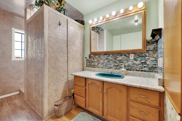 600 E 200 N, Mount Pleasant, UT 84647 - bathroom featuring vanity, wood finished floors, and backsplash