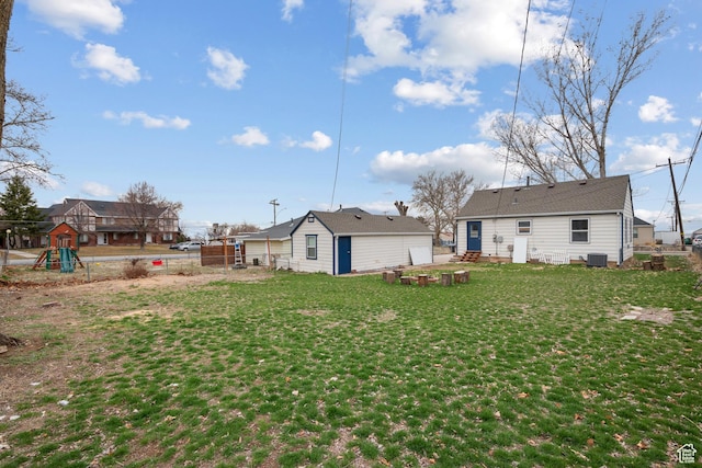 181 S 450 E, Clearfield, UT 84015 - back of property with central air condition unit, fence, a lawn, and a playground