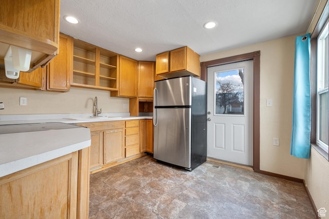 181 S 450 E, Clearfield, UT 84015 - kitchen with baseboards, recessed lighting, freestanding refrigerator, a sink, and light countertops