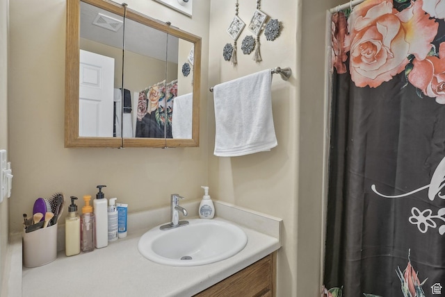 bathroom with vanity and visible vents