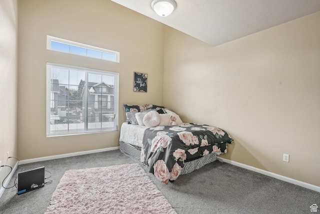 carpeted bedroom with baseboards