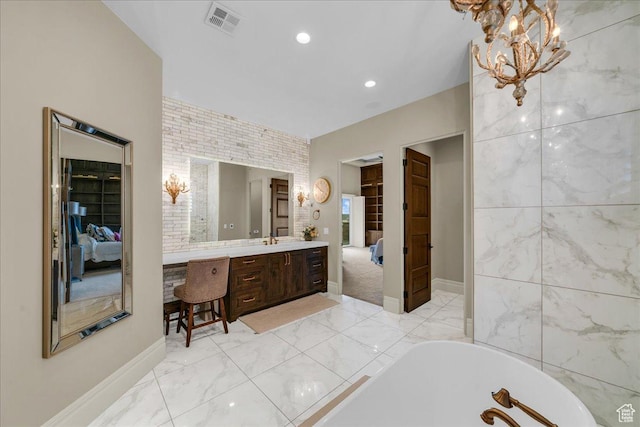 2255 S Hill Rd Unit 14, St George, UT 84790 - ensuite bathroom featuring a notable chandelier, visible vents, a bathing tub, and connected bathroom
