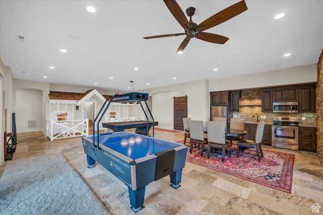 2255 S Hill Rd Unit 14, St George, UT 84790 - rec room with visible vents, stone tile floors, recessed lighting, arched walkways, and ceiling fan