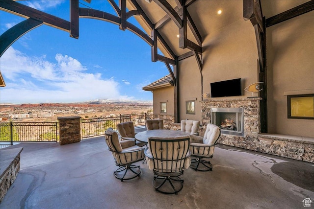 2255 S Hill Rd Unit 14, St George, UT 84790 - view of patio / terrace featuring outdoor dining space and an outdoor stone fireplace
