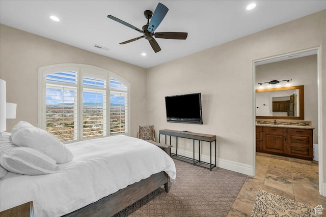2255 S Hill Rd Unit 14, St George, UT 84790 - bedroom with stone tile floors, baseboards, visible vents, recessed lighting, and connected bathroom