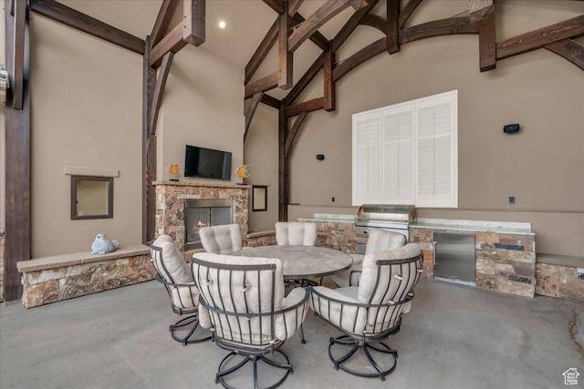 2255 S Hill Rd Unit 14, St George, UT 84790 - view of patio / terrace featuring grilling area, an outdoor kitchen, outdoor dining area, and an outdoor stone fireplace
