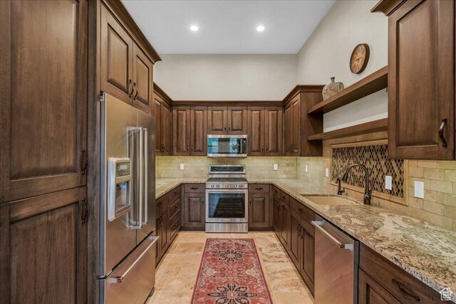 2255 S Hill Rd Unit 14, St George, UT 84790 - kitchen with a sink, open shelves, light stone countertops, and stainless steel appliances