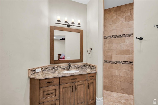 2255 S Hill Rd Unit 14, St George, UT 84790 - full bathroom featuring vanity, ensuite bathroom, a walk in shower, and backsplash