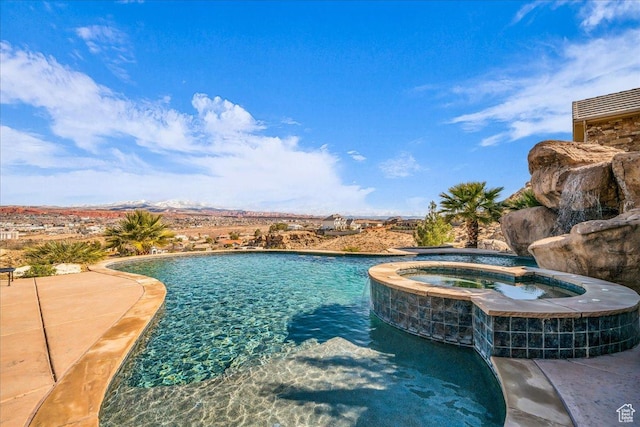2255 S Hill Rd Unit 14, St George, UT 84790 - view of swimming pool featuring a patio area and a pool with connected hot tub