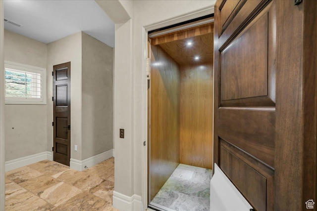 2255 S Hill Rd Unit 14, St George, UT 84790 - corridor with elevator, visible vents, and baseboards