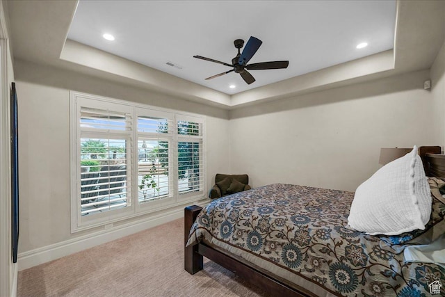 2255 S Hill Rd Unit 14, St George, UT 84790 - carpeted bedroom featuring a tray ceiling, visible vents, baseboards, and ceiling fan