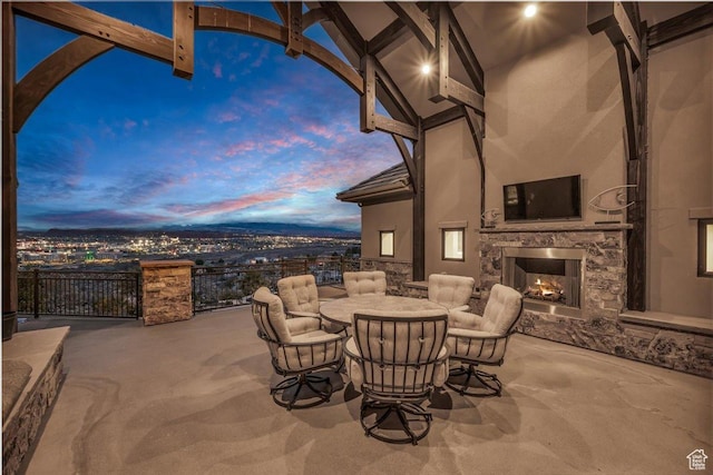2255 S Hill Rd Unit 14, St George, UT 84790 - view of patio / terrace featuring outdoor dining space and an outdoor stone fireplace