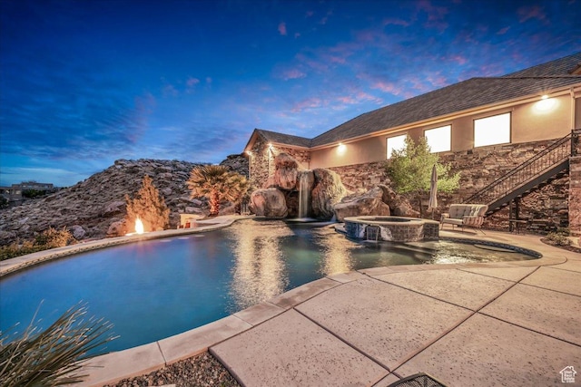 2255 S Hill Rd Unit 14, St George, UT 84790 - view of pool featuring a pool with connected hot tub, stairs, and a patio area