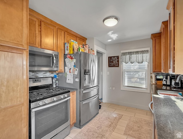 1054 34th St, Ogden, UT 84403 - kitchen with brown cabinets, baseboards, tasteful backsplash, and stainless steel appliances
