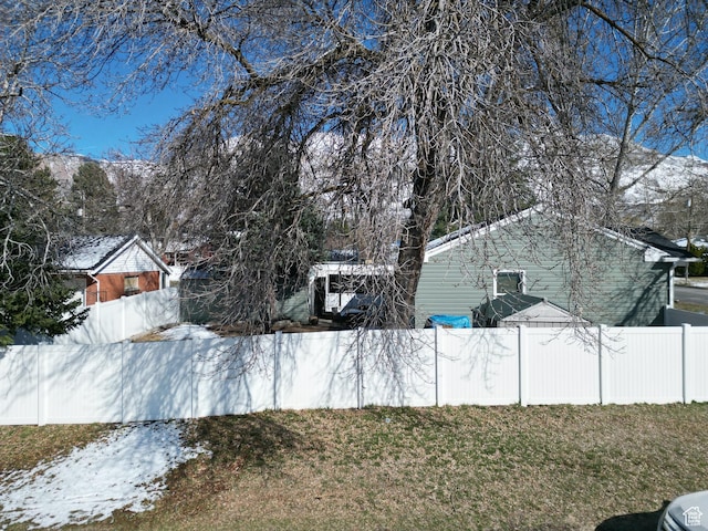 1054 34th St, Ogden, UT 84403 - yard covered in snow with fence