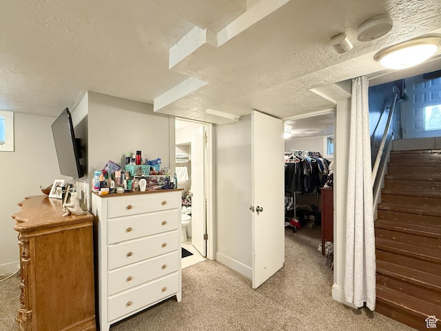 1054 34th St, Ogden, UT 84403 - interior space featuring a closet, connected bathroom, a textured ceiling, and a walk in closet