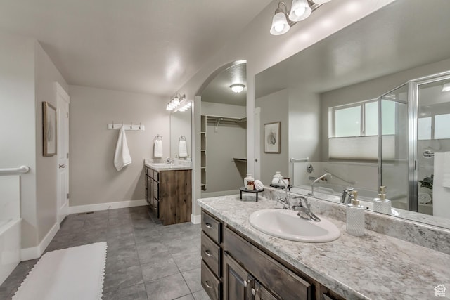 1879 E Tickville Cir, Eagle Mountain, UT 84005 - bathroom with two vanities, a sink, a shower stall, and tile patterned flooring