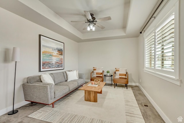 1879 E Tickville Cir, Eagle Mountain, UT 84005 - living area with a ceiling fan, baseboards, and a raised ceiling