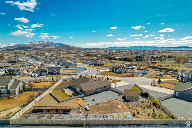 1879 E Tickville Cir, Eagle Mountain, UT 84005 - drone / aerial view featuring a mountain view and a residential view