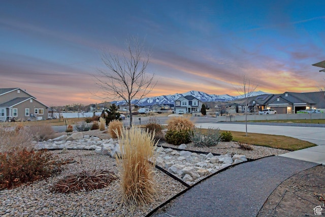 1879 E Tickville Cir, Eagle Mountain, UT 84005 - yard at dusk with a residential view