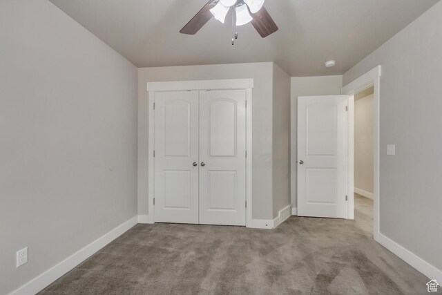 1879 E Tickville Cir, Eagle Mountain, UT 84005 - unfurnished bedroom featuring a ceiling fan, baseboards, a closet, and carpet