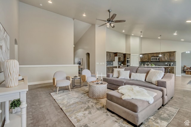 1879 E Tickville Cir, Eagle Mountain, UT 84005 - living room featuring high vaulted ceiling, arched walkways, a ceiling fan, and recessed lighting
