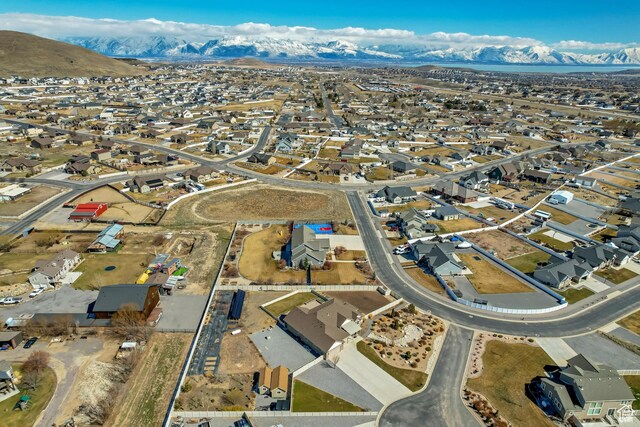 1879 E Tickville Cir, Eagle Mountain, UT 84005 - drone / aerial view featuring a residential view and a mountain view