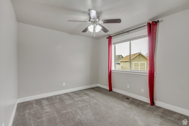 1879 E Tickville Cir, Eagle Mountain, UT 84005 - empty room featuring carpet floors, visible vents, a ceiling fan, and baseboards