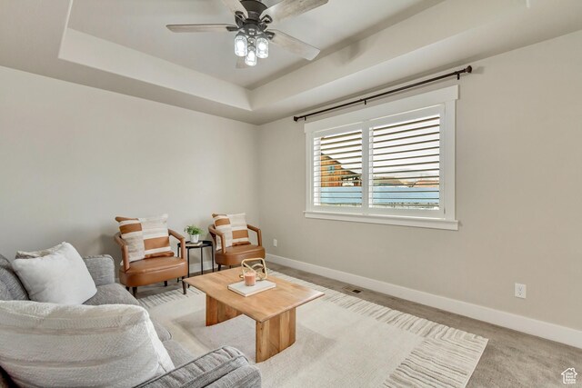 1879 E Tickville Cir, Eagle Mountain, UT 84005 - living room with a tray ceiling, a ceiling fan, and baseboards