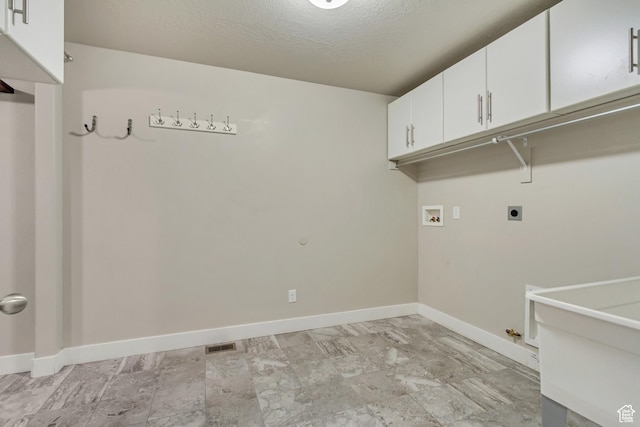 1879 E Tickville Cir, Eagle Mountain, UT 84005 - washroom with hookup for an electric dryer, gas dryer hookup, hookup for a washing machine, baseboards, and cabinet space