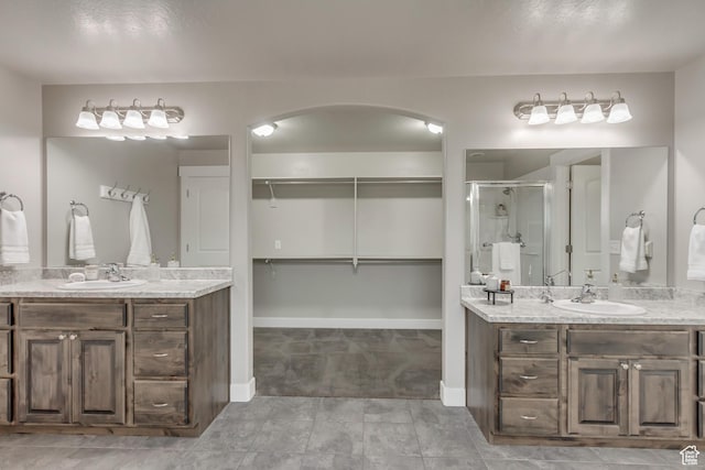 1879 E Tickville Cir, Eagle Mountain, UT 84005 - full bath with two vanities, a sink, and a stall shower