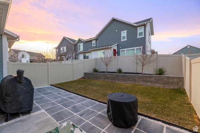 view of patio featuring a fenced backyard and grilling area