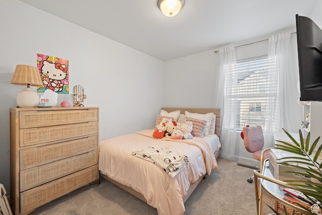 bedroom with light carpet