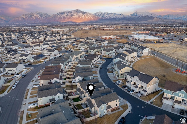 aerial view at dusk with a residential view and a mountain view