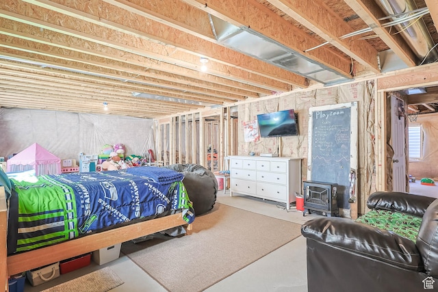 671 W 660 S, Tooele, UT 84074 - bedroom with concrete flooring and a wood stove