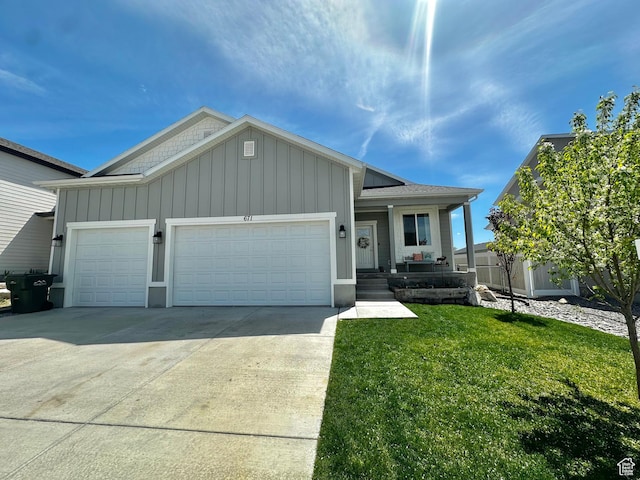 671 W 660 S, Tooele, UT 84074 - ranch-style home with driveway, board and batten siding, an attached garage, a porch, and a front lawn