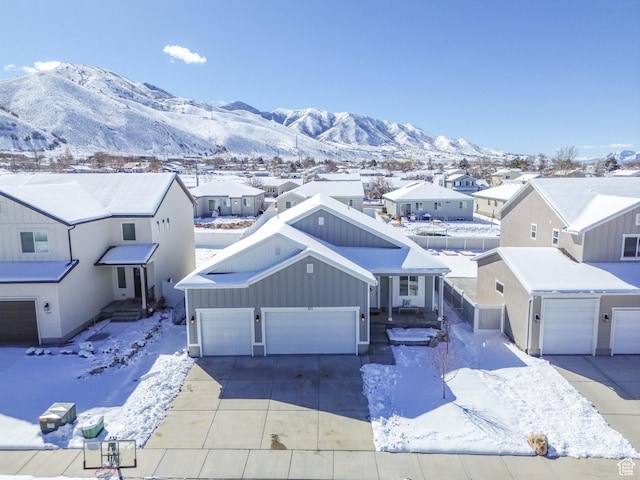 671 W 660 S, Tooele, UT 84074 - snowy aerial view featuring a residential view and a mountain view