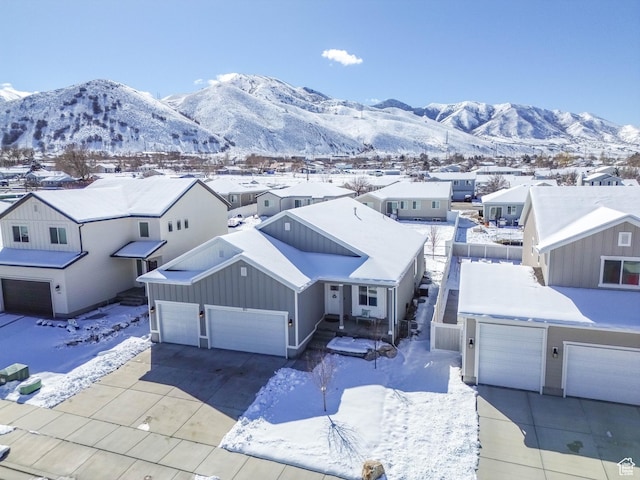 671 W 660 S, Tooele, UT 84074 - snowy aerial view with a mountain view and a residential view