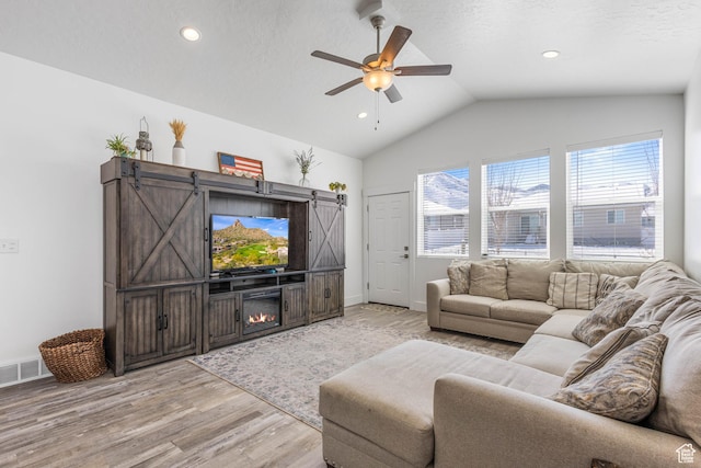 671 W 660 S, Tooele, UT 84074 - living area featuring visible vents, ceiling fan, recessed lighting, light wood finished floors, and vaulted ceiling