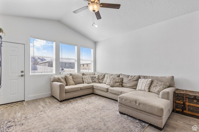 671 W 660 S, Tooele, UT 84074 - living room featuring baseboards, light wood-type flooring, a ceiling fan, and lofted ceiling