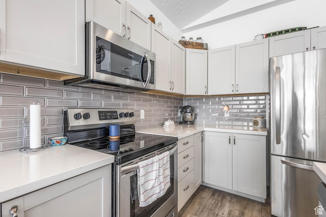 671 W 660 S, Tooele, UT 84074 - kitchen with light wood finished floors, stainless steel appliances, tasteful backsplash, light countertops, and lofted ceiling