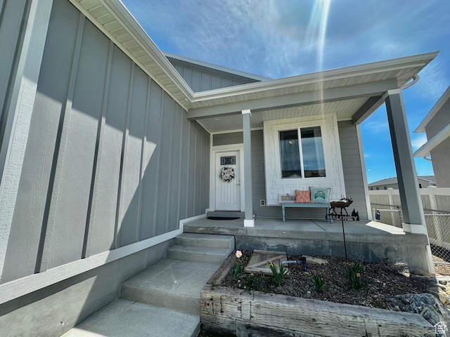 671 W 660 S, Tooele, UT 84074 - entrance to property featuring a porch, board and batten siding, and fence