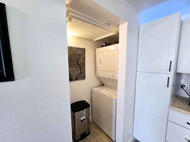 900 Bitner Rd Unit G-32, Park City, UT 84098 - laundry room featuring laundry area, stacked washer and clothes dryer, and light wood finished floors