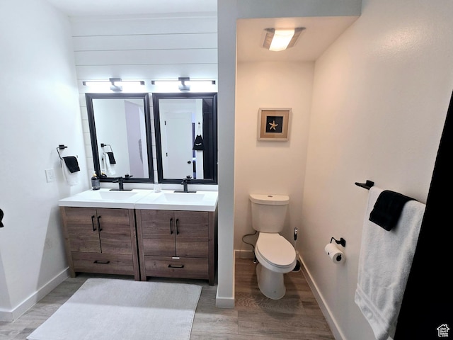 900 Bitner Rd Unit G-32, Park City, UT 84098 - bathroom with double vanity, wood finished floors, toilet, and a sink