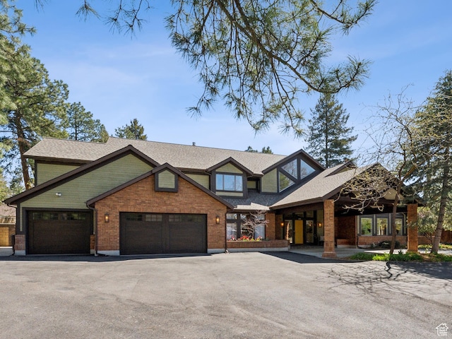 1919 E Baywood Dr, Holladay, UT 84117 - view of front of property featuring brick siding, a shingled roof, a garage, and aphalt driveway