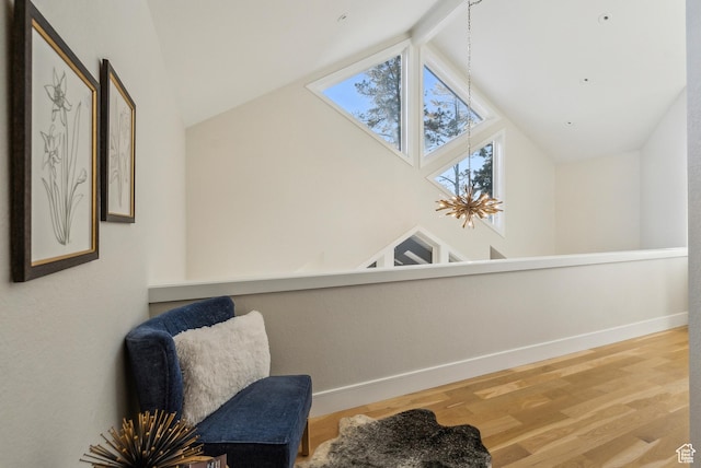 1919 E Baywood Dr, Holladay, UT 84117 - living area with high vaulted ceiling, a skylight, baseboards, and wood finished floors