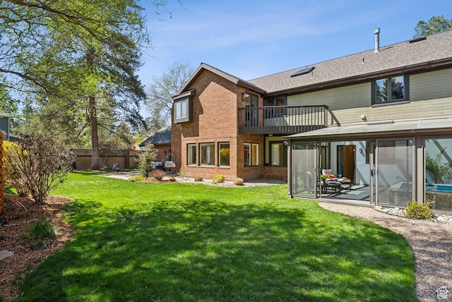 1919 E Baywood Dr, Holladay, UT 84117 - back of house featuring brick siding, fence, a sunroom, and a lawn