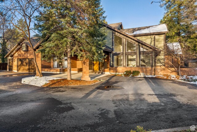 1919 E Baywood Dr, Holladay, UT 84117 - rustic home featuring a garage and driveway