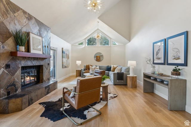 1919 E Baywood Dr, Holladay, UT 84117 - living area featuring baseboards, a premium fireplace, an inviting chandelier, and wood finished floors